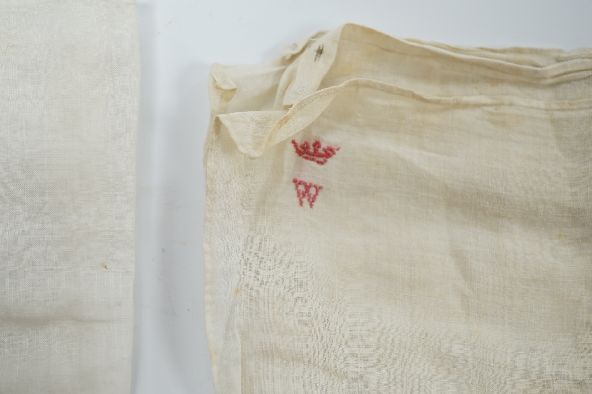 Two handkerchiefs, each bearing an embroidered ‘W’ below a coronet, understood without guarantee to relate to The Duke of Wellington, 36 x 34cm. Condition - fair, some staining and foxing